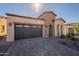 Single-story home with brick accents and a two-car garage at 375 E Bracciano Ave, Queen Creek, AZ 85140
