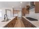 Modern kitchen with wood cabinets and stainless steel appliances at 375 E Bracciano Ave, Queen Creek, AZ 85140