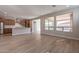 Open concept kitchen and living area with hardwood floors and modern kitchen at 375 E Bracciano Ave, Queen Creek, AZ 85140