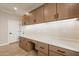 Bright laundry room with ample counter and cabinet space at 375 E Bracciano Ave, Queen Creek, AZ 85140