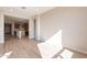 Open living room with view of kitchen and hallway at 375 E Bracciano Ave, Queen Creek, AZ 85140