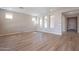 Living room with hardwood floors and access to hallway and other rooms at 375 E Bracciano Ave, Queen Creek, AZ 85140
