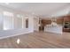 Spacious living room with hardwood floors and views into the kitchen at 375 E Bracciano Ave, Queen Creek, AZ 85140