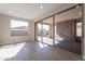Living area with sliding glass doors opening to a backyard patio at 375 E Bracciano Ave, Queen Creek, AZ 85140