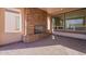 Covered patio with brick fireplace and paver floor at 375 E Bracciano Ave, Queen Creek, AZ 85140