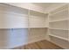 Spacious walk-in closet with ample shelving and hanging rods at 375 E Bracciano Ave, Queen Creek, AZ 85140