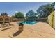 Community pool with lounge chairs and covered area at 4065 E University Dr # 01, Mesa, AZ 85205