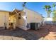 Exterior view of mobile home with AC unit and landscaped area at 4065 E University Dr # 01, Mesa, AZ 85205