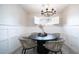 Formal dining room with a round table, four chairs, and a chandelier at 4329 E Hubbell St, Phoenix, AZ 85008