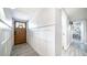 Bright entryway with wood-look flooring and white wainscoting at 4329 E Hubbell St, Phoenix, AZ 85008