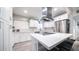 Modern kitchen with white shaker cabinets, quartz countertops, and stainless steel appliances at 4329 E Hubbell St, Phoenix, AZ 85008