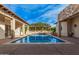 Inviting pool with stonework and pergola at 5791 S Columbus Ct, Gilbert, AZ 85298