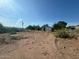 Backyard with a shed, sparse vegetation, and a distant mountain view at 709 N San Manuel Ave, Mammoth, AZ 85618