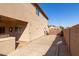 Backyard with a side gate and view of neighboring homes at 8227 W Rose Garden Ln, Peoria, AZ 85382