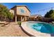 Inviting backyard pool with a patio and string lights at 8227 W Rose Garden Ln, Peoria, AZ 85382