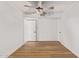 Bright bedroom featuring light walls, wood-look flooring, and ceiling fan at 8825 N 29Th Ave, Phoenix, AZ 85051