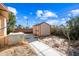 Backyard view featuring a storage shed and AC unit at 1219 E Barcelona Ave, Casa Grande, AZ 85122