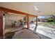 Covered patio with outdoor dining area and access to the backyard at 1219 E Barcelona Ave, Casa Grande, AZ 85122