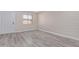 Simple bedroom with wood-look floors and exposed brick wall at 1234 N 36Th St # 203, Phoenix, AZ 85008