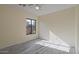 Well-lit bedroom with wood-look floors and ceiling fan at 1670 E Joseph Way, Gilbert, AZ 85295