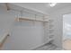 Large walk-in closet with shelves and hanging rods at 1670 E Joseph Way, Gilbert, AZ 85295