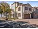 Two-story house with attached garage and landscaped yard at 1670 E Joseph Way, Gilbert, AZ 85295