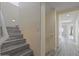 Stylish staircase with wood-look flooring and stained glass window at 1670 E Joseph Way, Gilbert, AZ 85295