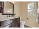 Bathroom with dark vanity, quartz countertop, and large mirror at 2724 S Falling Star Rd, Gold Canyon, AZ 85118