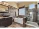 Bathroom with walk-in shower, soaking tub and mountain views at 2724 S Falling Star Rd, Gold Canyon, AZ 85118