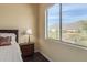 Bedroom with mountain views and a dark wood nightstand at 2724 S Falling Star Rd, Gold Canyon, AZ 85118