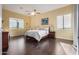 Bright bedroom with dark wood floors and mountain views at 2724 S Falling Star Rd, Gold Canyon, AZ 85118