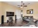 Spacious bonus room with leather sectional sofa and large TV at 2724 S Falling Star Rd, Gold Canyon, AZ 85118