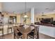 Kitchen dining area with dark wood table and seating for six at 2724 S Falling Star Rd, Gold Canyon, AZ 85118