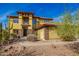 Two-story house with stone accents and desert landscaping at 2724 S Falling Star Rd, Gold Canyon, AZ 85118