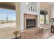 Living room fireplace with built-in shelving and desert views at 2724 S Falling Star Rd, Gold Canyon, AZ 85118