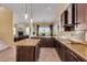 Island kitchen with granite countertops and a view to the living room at 2724 S Falling Star Rd, Gold Canyon, AZ 85118