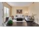 Living room with dark hardwood floors, neutral decor, and large windows at 2724 S Falling Star Rd, Gold Canyon, AZ 85118