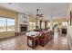 Open living room and kitchen with tile floors and a fireplace at 2724 S Falling Star Rd, Gold Canyon, AZ 85118