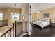 Spacious main bedroom with dark wood floors and access to a balcony at 2724 S Falling Star Rd, Gold Canyon, AZ 85118