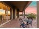 Covered patio with table and chairs, overlooking the desert at 2724 S Falling Star Rd, Gold Canyon, AZ 85118