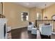 Upstairs sitting area with fireplace and two white armchairs at 2724 S Falling Star Rd, Gold Canyon, AZ 85118