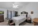 Primary bedroom with patio access and ceiling fan at 3401 N Dakota St, Chandler, AZ 85225