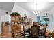 Bright dining area with a round table, view of kitchen, and wood hutch at 3401 N Dakota St, Chandler, AZ 85225