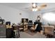Home office with built-in shelving and a comfortable chair at 3401 N Dakota St, Chandler, AZ 85225