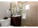 Small bathroom with a toilet, vanity, and shower at 4311 E Roma Ave, Phoenix, AZ 85018