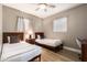 Guest bedroom with twin beds and a work space at 4311 E Roma Ave, Phoenix, AZ 85018