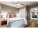 Spacious bedroom with a queen bed, and view into another room at 4311 E Roma Ave, Phoenix, AZ 85018