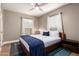 Bedroom with a king-size bed and a modern wood frame at 4311 E Roma Ave, Phoenix, AZ 85018