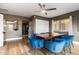 Bright dining room features a wood table and blue velvet chairs at 4311 E Roma Ave, Phoenix, AZ 85018