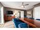 Modern dining room with a large wooden table and blue velvet chairs at 4311 E Roma Ave, Phoenix, AZ 85018